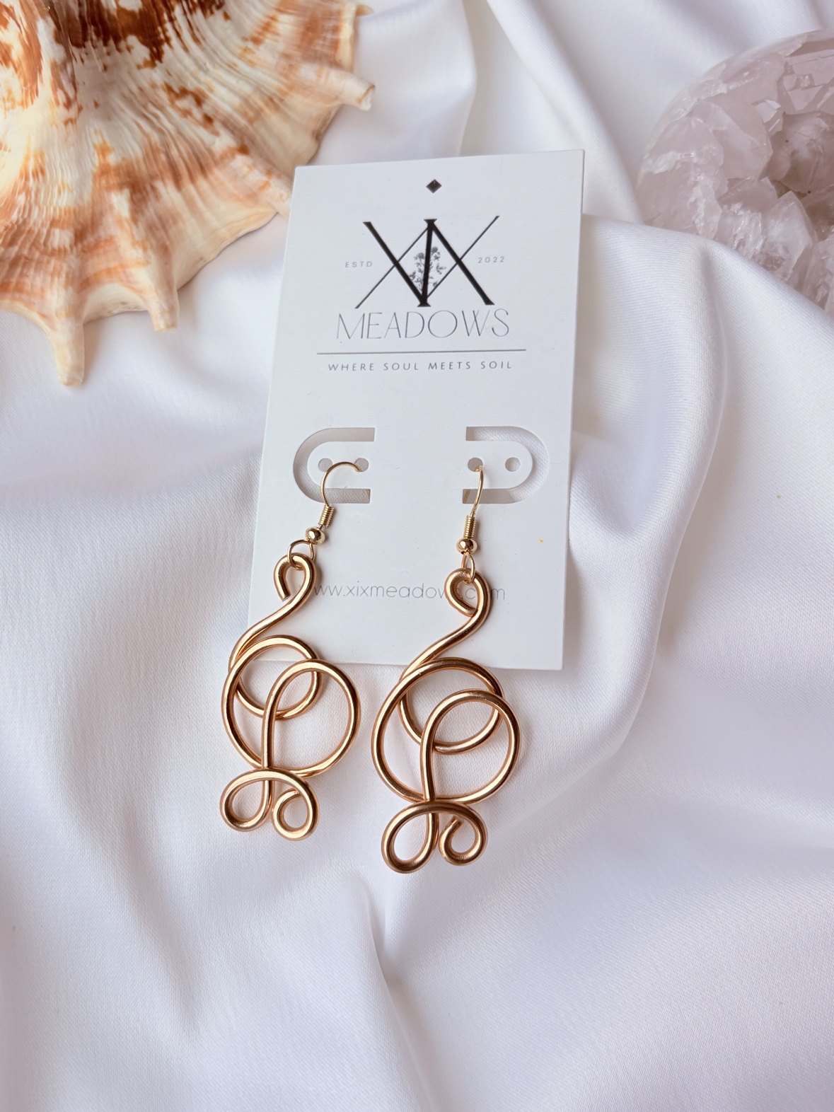 Abstract gold wire earrings on a XiX Meadows card